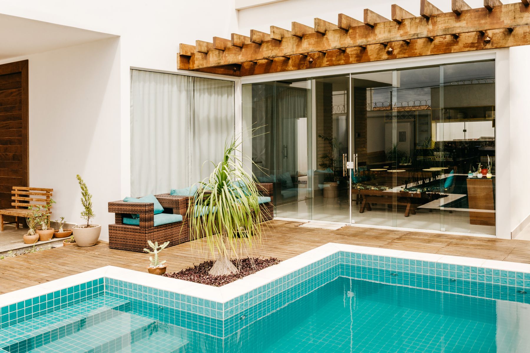 Illustrative outdoor living area with seating and a shaded gathering space